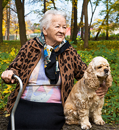 Elderly woman and dog